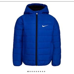Royal blue Nike full zip puffer jacket with hood.  Boys size 7. New in bag.